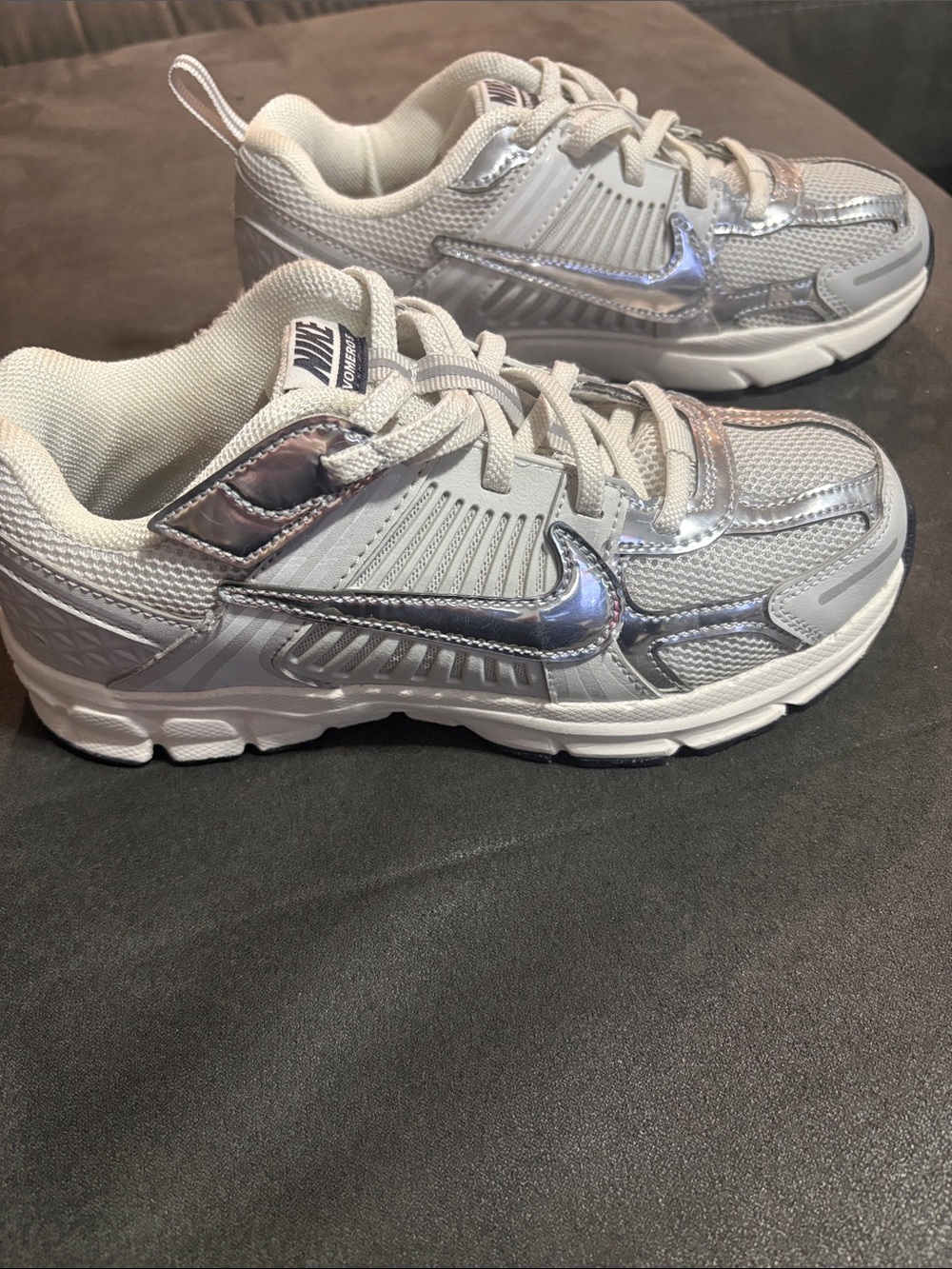 Nike Kids White Sneakers with Silver Metallic Swoosh